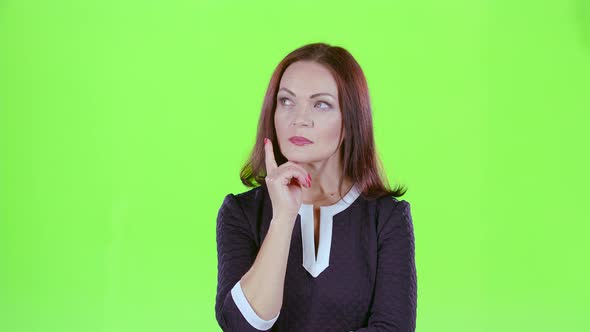 Woman Thinks and She Has an Idea in Her Head. Green Screen