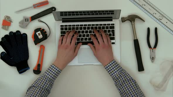 Engineer Male Hands Typing on Laptop at Workplace