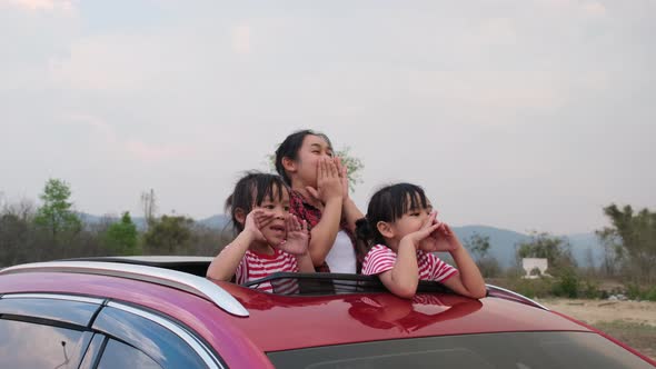 Happy family enjoying road trip on summer vacation.