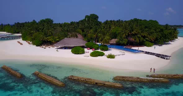 Beautiful drone clean view of a white sandy paradise beach and blue ocean background in colorful