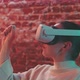 Close up of young woman in vr goggles looking around and smiling - VideoHive Item for Sale