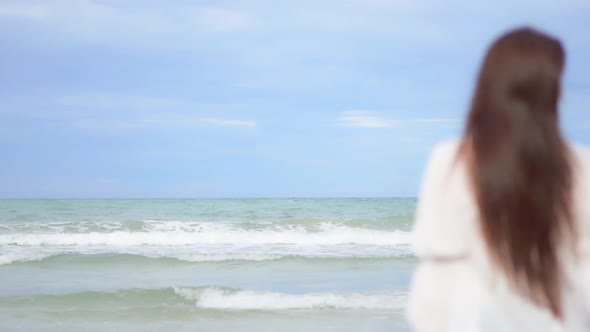 Asian woman enjoy around beautiful beach sea ocean