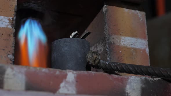 crucible with metal in the furnace