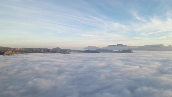 Aerial view of False bay covered in low cloud sunrise, Simonstown, Cape Town, South Africa.