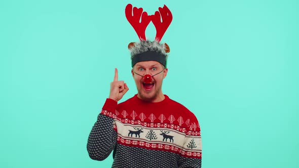 Excited Man in Christmas Sweater Make Gesture Raises Finger Came Up with Creative Plan Good Idea