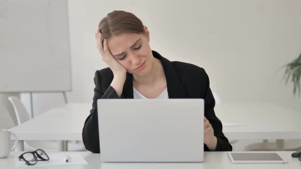 Upset Young Businesswoman Reacting to Failure of Project