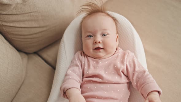 Happy Girl in Baby Nest