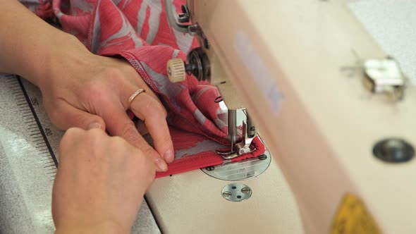 Closeup of Seamstress Sewing on Sewing Machine