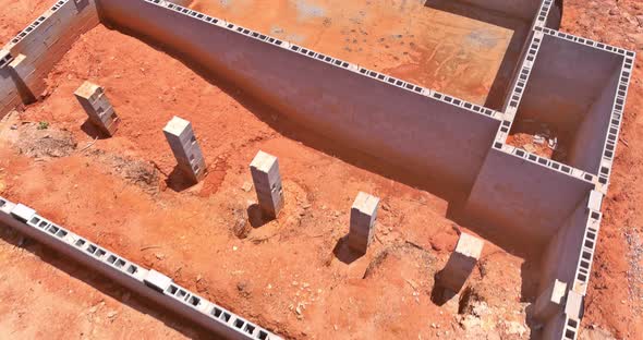 Aerial Down View on Construction Site with Concrete Blocks for House Foundation