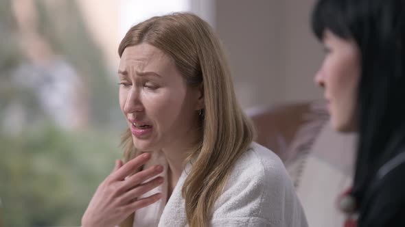 Desperate Hopeless Woman Crying Talking with Empathetic Friend Supporting Sad Lady Passing Paper