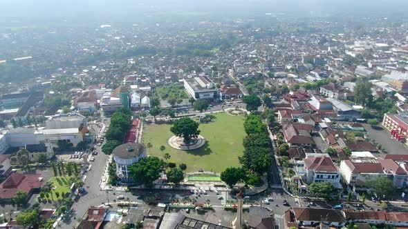 Morning traffic in city square in Magelang, Indonesia, aerial panorama