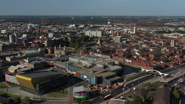 Fast aerial pan from left to right of Hull City Centre and with sun glinting off buildings windows