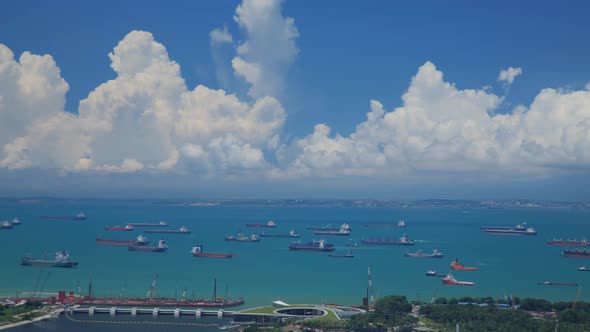 Time Lapse shot of hundreds of cargo ships anchored off the coast of Singapore