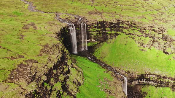 Aerial View of Stunning Waterfall in Faroe Islands