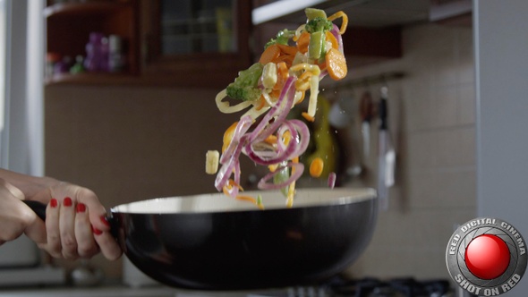 Cooking Vegetables On A Frying Pan Throwing Food In Slow Motion In The KitchenShot On Red Camera