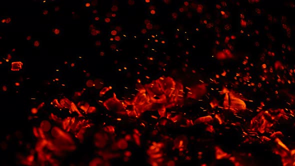 Super Slow Motion Shot of Glowing Coal and Fire Sparks Isolated on Black Background at 1000Fps