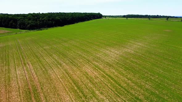 Aerial drone view of a flying over the rural agricultural landscape.