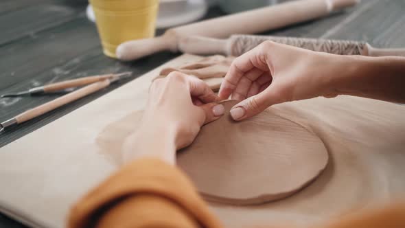 Beautiful Potter Master Woman Molds From Clay Pot in Master