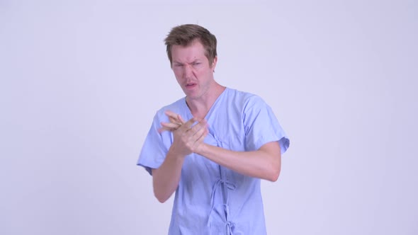 Portrait of Young Man Patient Air Boxing in Fighting Stance