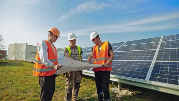 Engineers working on repair solar panel