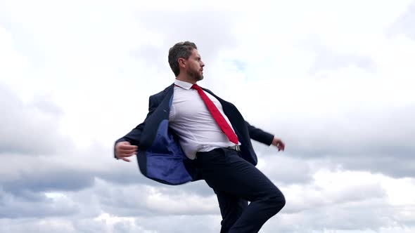 Successful Man Boss in Formal Suit Dance in Cloudy Sky Freedom