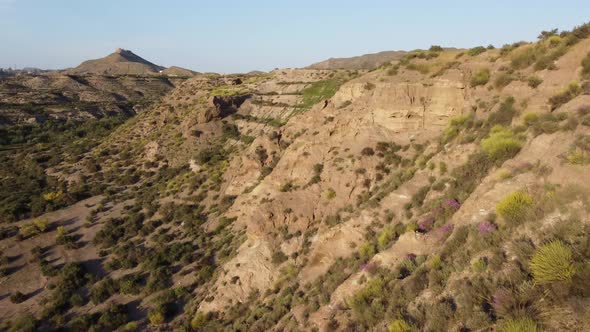 Flying next to a cliff in the tabernas desert during the golden hour