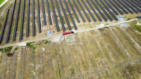 Aerial View of Electrical Power Plant Under Construction with Truck Delivering Assembly Parts for