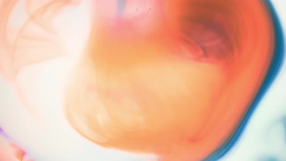 Ink in Water. Teal and Orange Ink Reacting in Water Creating Abstract Background. alt