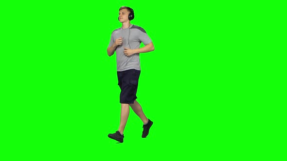 Man in Big Black Headphones Is Running, Chroma Key