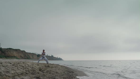 Man Training Martial Technique on Seacoast