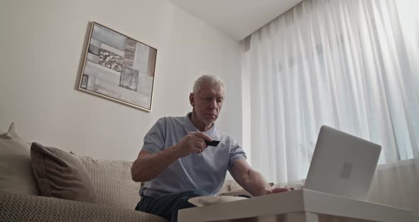 Senior Man Making Online Purchases