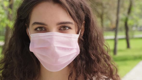 Close Up of Woman in Face Mask Outdoors