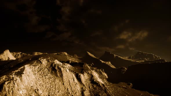 Dark Clouds Over Volcanic Valley with Grass and Rocks