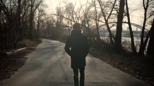 Businessman On Jacket Walking At Fall. Confidence Man Walking On Road At Sunrise. Walk On Autumn.