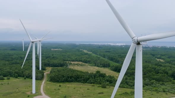 Aerial View of Powerful Wind Turbine Farm for Energy Production on Beautiful Cloudy Sky