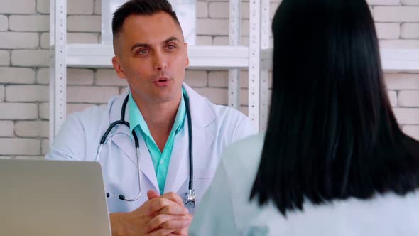 Doctor in Professional Uniform Examining Patient at Hospital