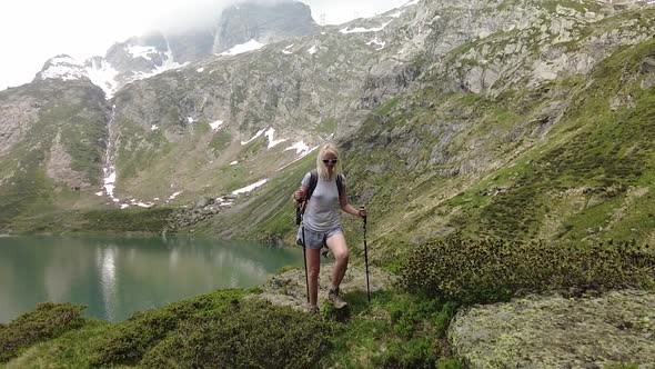 Tourist Woman Trekking By Robiei Lake