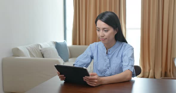 Woman use of tablet computer at home