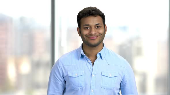 Portrait of Smiling Businessman Looking at Camera