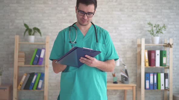 Portrait of Male Doctor Middleaged in Uniform with Stethoscope