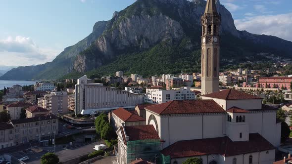 Townscape and square with sculpture Mario Cerme, Lecco, Italy