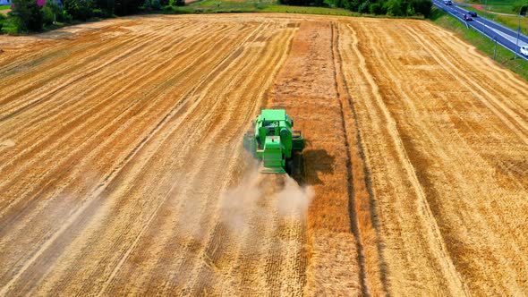 Aerial view of harvesters working on field in summer