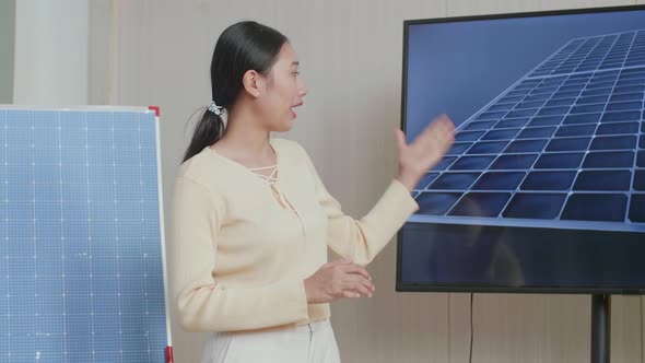 Asian Woman Engineer Presenting About The Work Of Solar Cell At The Office