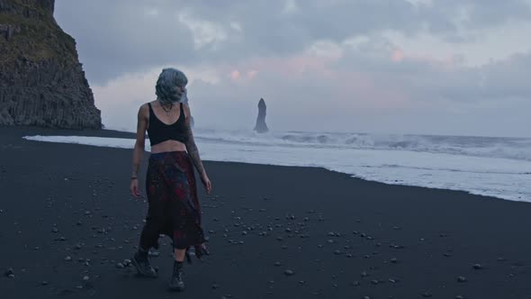 Cool Girl With Blue Hair On Black Beach