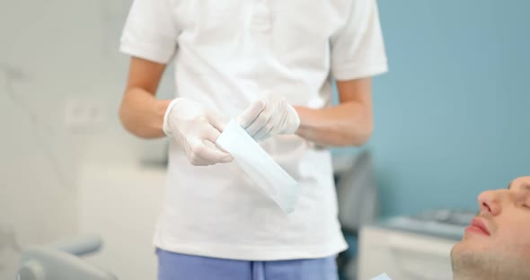 Dentist Preparing for the Dental Checkup