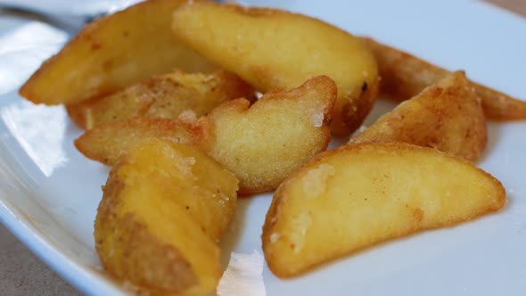 Close-up of fried potatoes. Fast food is fatty, not healthy food.