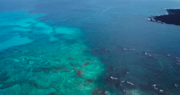 The Big Island of Hawai'i housing beautiful contrasts of black, green and blue, all shown from above