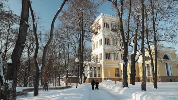 Gomel Belarus January 27 2019 People Walking In Snowy City Park Near RumyantsevPaskevich Palace In