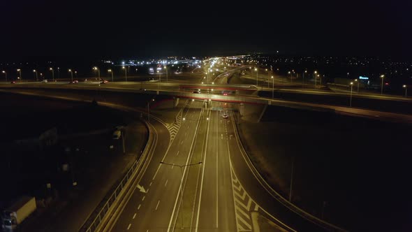 Aerial View of a Large Multilane Highway with Bridges and Viaducts at Night