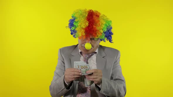 Elderly Clown Businessman Entrepreneur Boss Dancing, Entertains, Receive Money